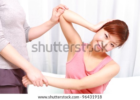 young Japanese woman receiving thai massage