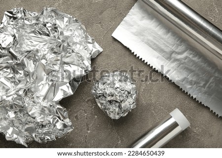 Similar – Image, Stock Photo aluminum foil, rolled aluminum foil, close-up on a black background,