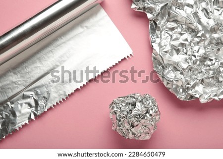 Similar – Image, Stock Photo aluminum foil, rolled aluminum foil, close-up on a black background,