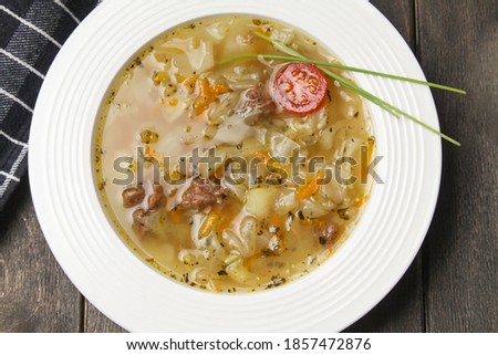 Traditional Russian Cabbage Soup Schi With Rye Bread Sliced On Wooden Board On Black Background. Flat Lay. Close Up. Imagine de stoc © 