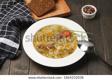 Traditional Russian Cabbage Soup Schi On White Plate With Sliced Rye Bread On Wooden Background. Imagine de stoc © 
