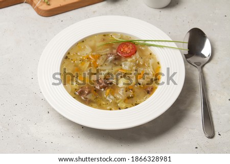 Traditional Russian Cabbage Soup Schi With Spoon On Grey Background. Top View. Imagine de stoc © 
