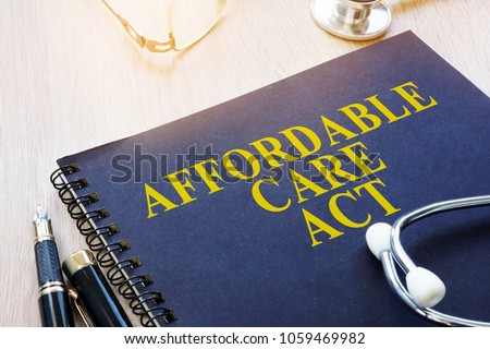 Affordable Care Act ACA and stethoscope on a table. Imagine de stoc © 