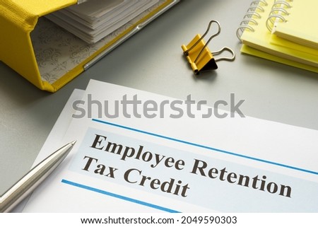 Employee retention tax credit papers and folder.