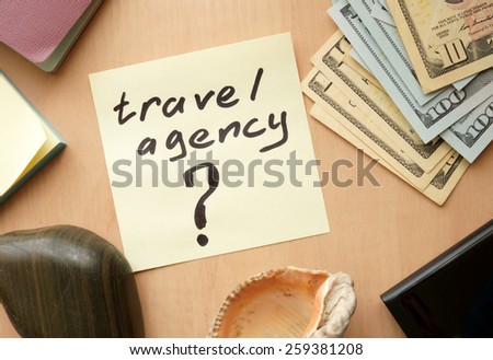 Travel agency paper on a table with money