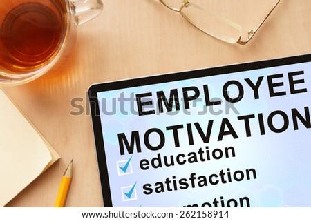 Tablet with words employee motivation. Business concept.