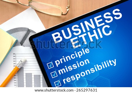 Tablet with words business ethic. Business and management concept.