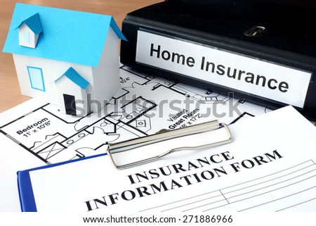 Model of house and folder with home insurance. Business  concept