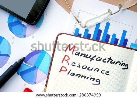 Notepad with words MRP manufacturing resource planning  concept and marker.