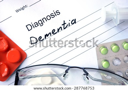 Form with diagnosis Dementia and tablets. Medical concept.