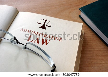 Code of  administrative law on a wooden table.