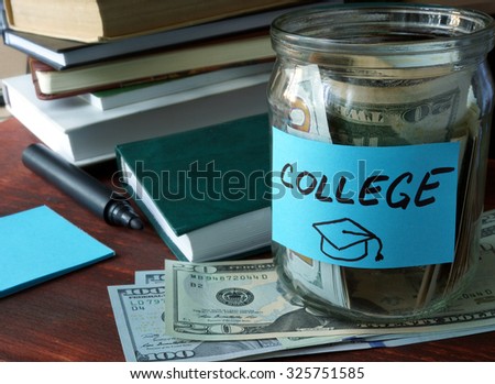 Jar with label college and money on the table.