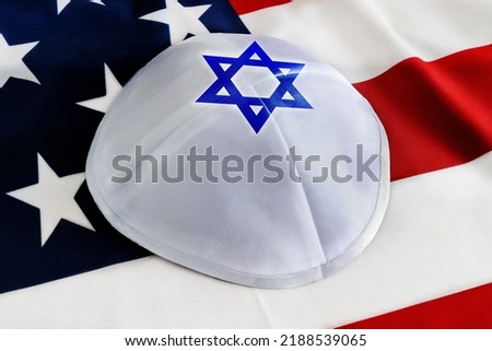 Jewish Kippah on the background of the American Flag. Concept: USA Jews, Diaspora, Jewish Community in United States of America, Jewish Americans - American citizens Photo stock © 