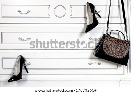 shoes and bag hanging on my closet