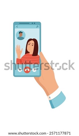 A person holds a smartphone with video chat. A user interacts with the devices screen. The mobile phone displays video chat application that illustrates modern communication. This visual format suits