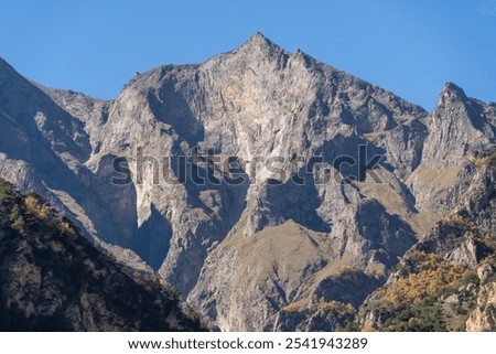 Similar – Foto Bild Felsen mit steilen Hängen in gebirgigem Terrain