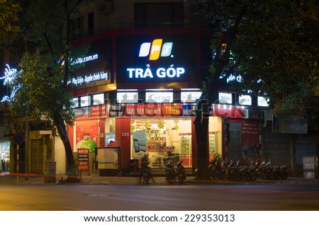 Hanoi, Vietnam - Nov 2, 2014: Front view of a mobile phone store of FPT Telecom in Hanoi capital at night. FPT is one of the biggest technology groups in Vietnam.