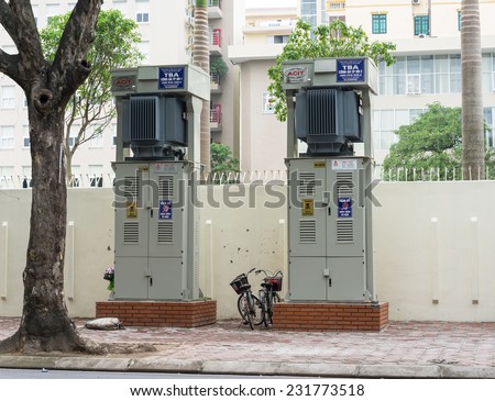 Hanoi, Vietnam - Nov 16, 2014: Electric cabinets on sidewalk of Tran Hung Dao street. Many electric boxes staying on sidewalk are dangerous, especially in raining season