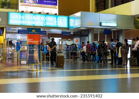 Hanoi, Vietnam - Nov 27, 2014: Passengers in line at domestic boarding gate in Noi Bai airport