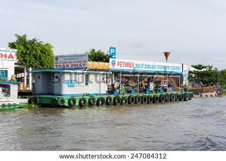 Can Tho, Vietnam - Nov 30, 2014: A floating mobile gasoline and oil station on Tien river, Mekong delta