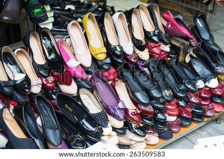 Hanoi, Vietnam - Mar 15, 2015: Various type of woman shoes for sale on a store in Hanoi