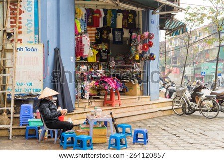 Hanoi, Vietnam - Mar 15, 2015: Exterior view of small fashion shop on Chua Boc street. A small tea stall front of the shop