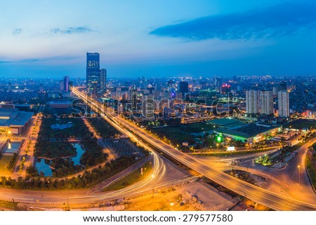 Aerial view of city at sunset. Hanoi cityscape at intersection Thang Long boulevard - Pham Hung street - Tran Duy Hung street