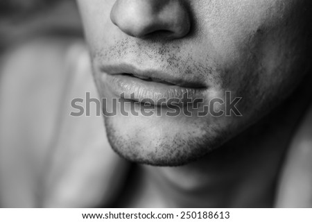 Close up of male arm. Holding on the shoulder. Black and white portrait.
