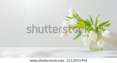 Similar – Foto Bild Blumenstrauß aus weißen Tulpen in einer Vase