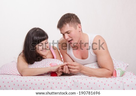 Young man offers the young girl to marry him, and gives a ring