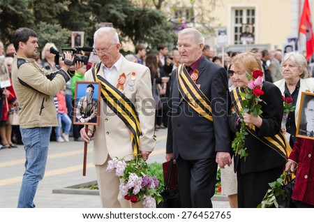 Volgograd, Russia - may 07, 2015: War veterans laid flowers at the monument