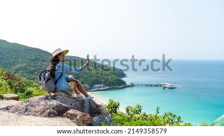 Similar – Image, Stock Photo Traveler enjoying freedom while standing on hilltop and observing wide highland