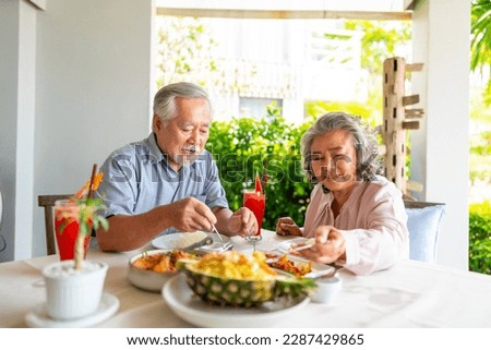 Similar – Foto Bild Fröhliches Paar beim Mittagessen im Cafe