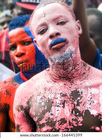 CAP-HAITIEN, HAITI - NOV 18, Full body painted supporters of president Michel Martelly  requesting life improvements during his visit on November 18, 2013 in Cap-Haitien, Haiti.