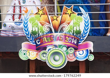 SANTO DOMINGO, DOMINICAN REPUBLIC - MARCH 2  Logo of the 2014 Carnival with  the queens dresses partially showing on top of platform on March 2, 2014 in Santo Domingo, Dominican Republic.