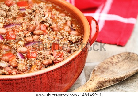 Chili Con Carne in a red ceramic pot.
