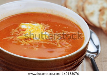 Tomato Bisque with sour cream and cheddar cheese.