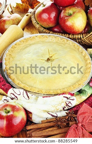 Delicious fresh baked apple pie with ingredients. Perfect for the holidays.
