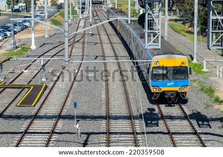 MELBOURNE, AUSTRALIA -  September 21, 2014: local Metro train near Springvale train station. Majority-owned by Hong Kong's MTR Corporation, Metro moves 228 million passengers every year.