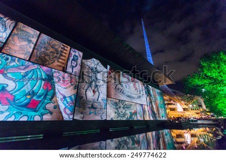 MELBOURNE, AUSTRALIA - February 22, 2014: projections of images of tattoos and tattooed people onto the National Gallery of Victoria (NGV) during the White Night arts festival.