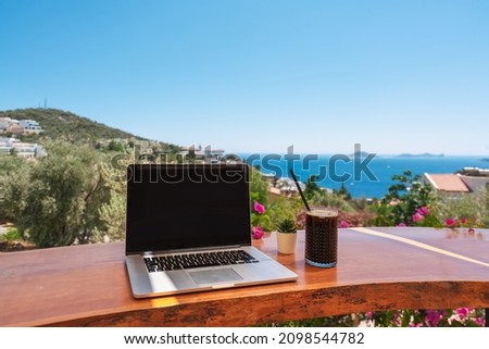 Similar – Image, Stock Photo Laptop on terrace table in front of flowers