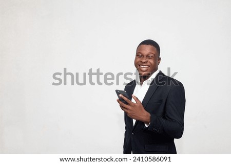 Similar – Image, Stock Photo Stylish black businessman chatting on smartphone against building wall