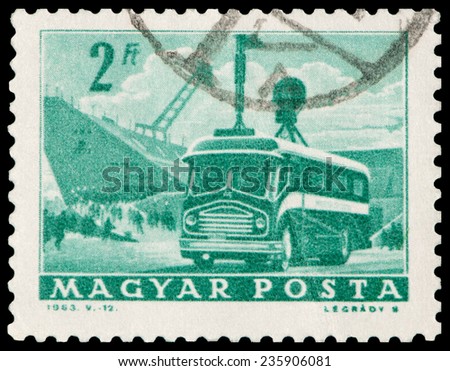 HUNGARY - CIRCA 1963: A stamp printed in the Hungary shows old bus as mobile radio transmitter and stadium, circa 1963