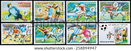 VIETNAM - CIRCA 1990: A stamp printed by Vietnam shows football players. World football cup in Italy, circa 1990