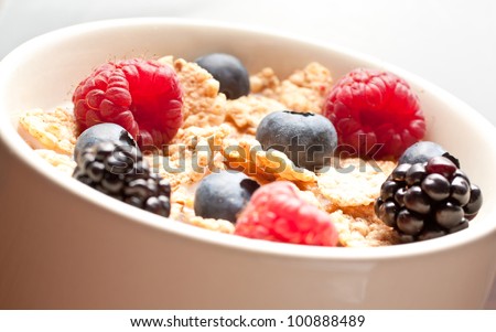 Healthy breakfast with milk, corn flakes and soft fruit