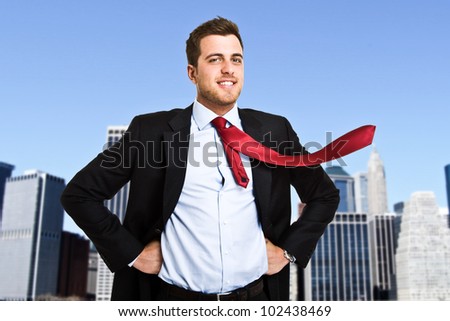 Businessman posing as a superhero