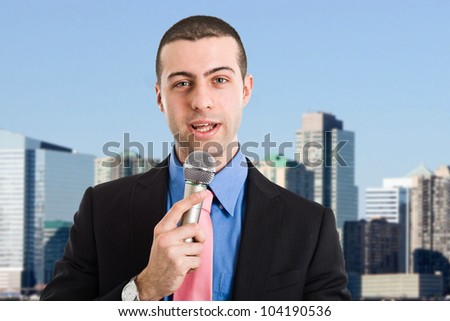 Portrait of a man speaking in a microphone
