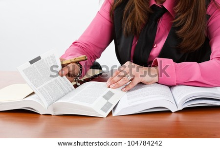 Woman examining books and documents