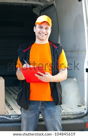 Smiling guy delivering a parcel