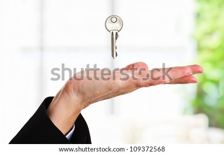 Female hand receiving a key